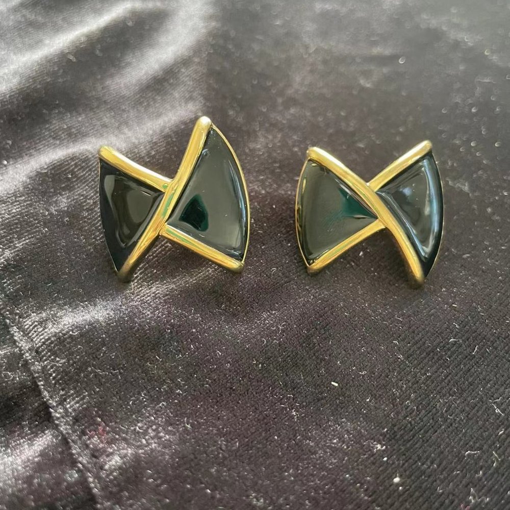 vintage monet gold tone black enamel earrings clip on